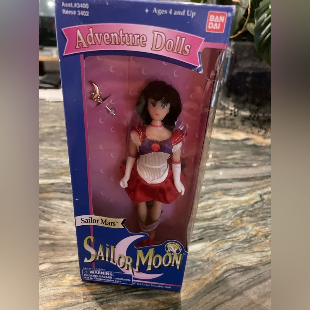 Bandai Sailor Moon show- Sailor Mars 6” doll, new in box. Top of box has tear